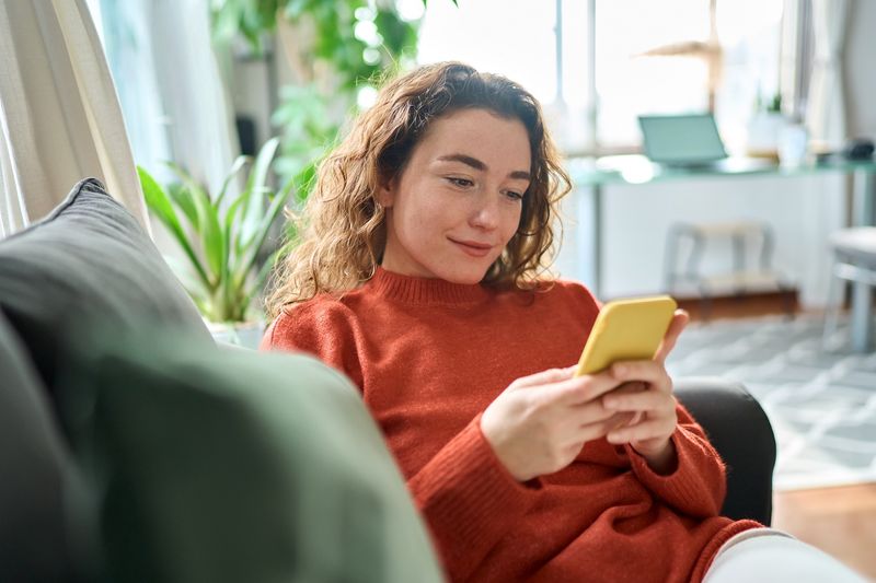 Young girl holding phone