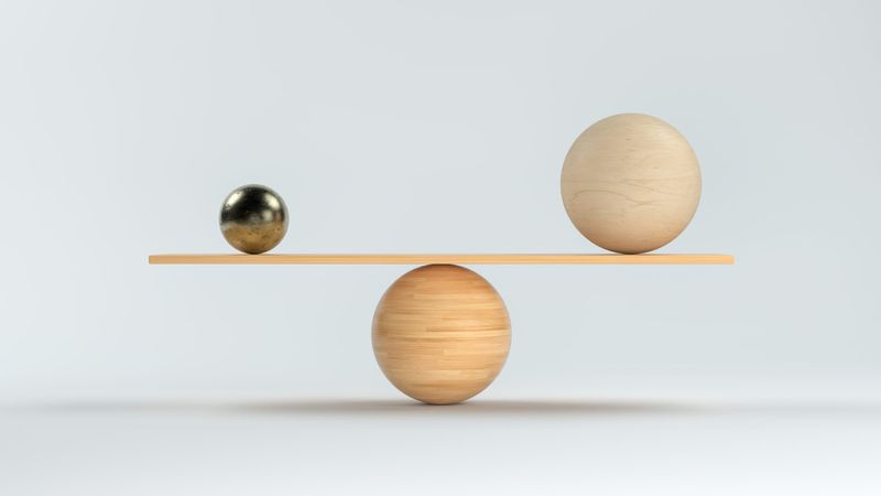 two balls balancing on a third